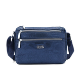 Vállra akasztható női táska metál hatással – sötétkék